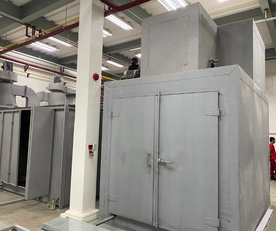 Batch type oven beside a spray booth